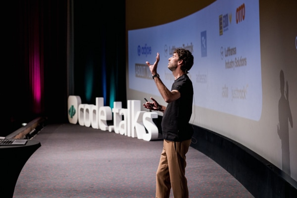 Collage image showing people at a previous code.talks event